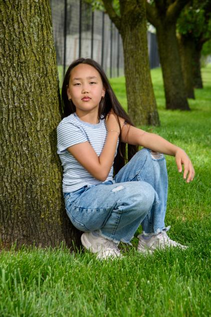 child in front of trees