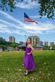girl in front of USA flag