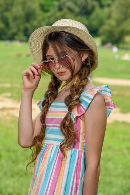young girl with rose colored glasses