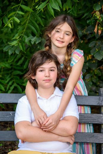 brother and sister on NYC park bench