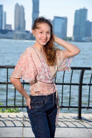 girl posing in front of hudson river