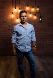 young guy in front of cool lights