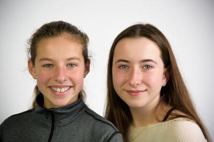 two friends smiling in portrait