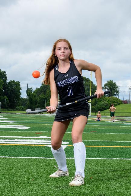 student playing field  hockey
