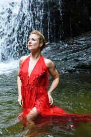 gown in water with waterfall