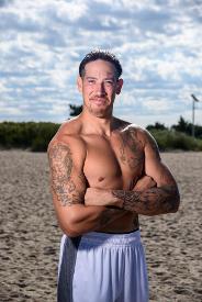 shirtless man on beach